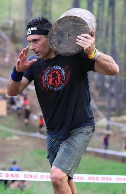 Carrying a heavy log on the trail